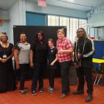 People in classroom wearing black
