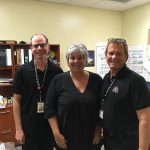 3 members of staff wearing black clothes