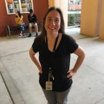 Lady with hands on hips wearing black