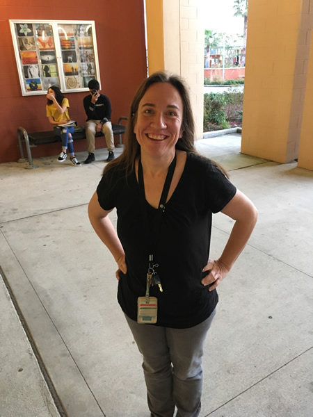 Lady with hands on hips wearing black
