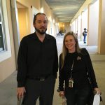 Tall man and lady wearing black
