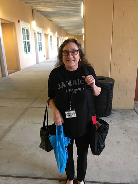 Lady wearing black Jamaica shirt