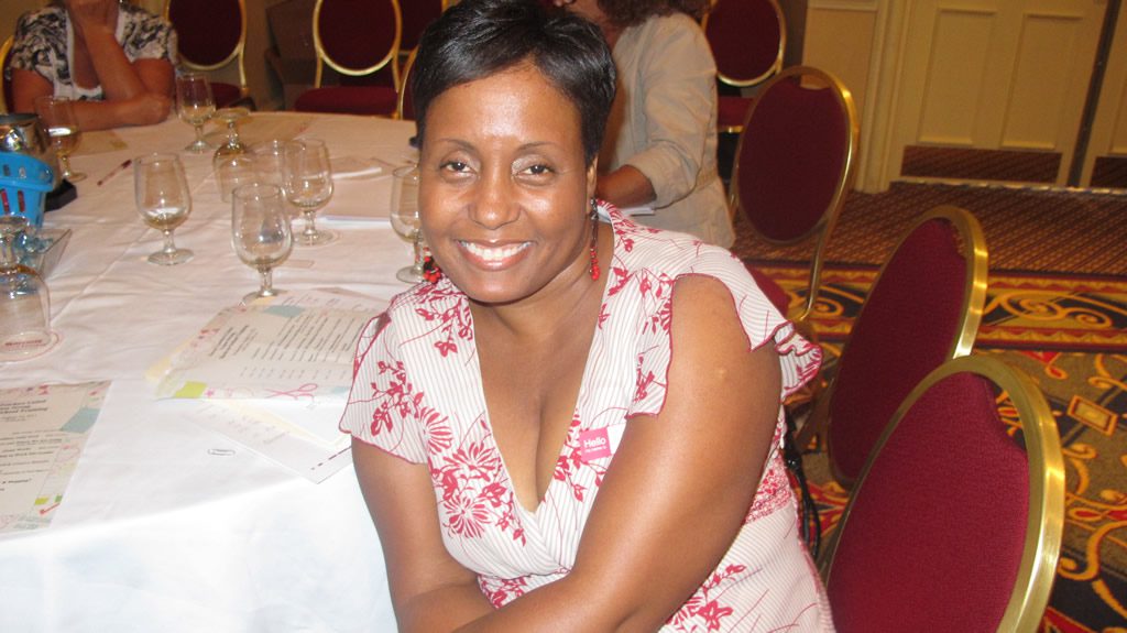 Lady in white and red dress smiling