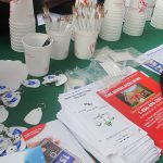 Variety of leaflets and flyers on a green table