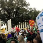 Signs being held at rally