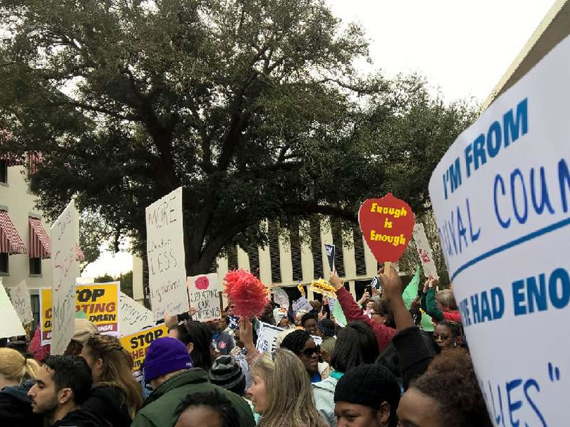 Signs being held at rally