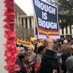 Enough is enough sign being held at rally