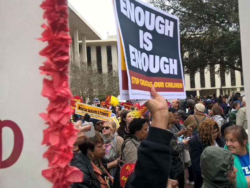Enough is enough sign being held at rally