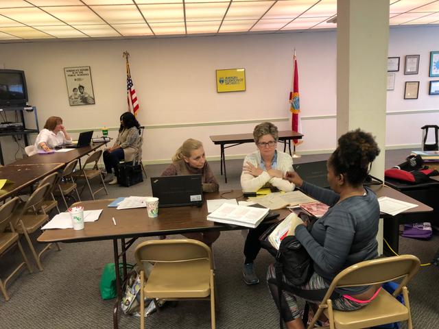 3 ladies at table talking