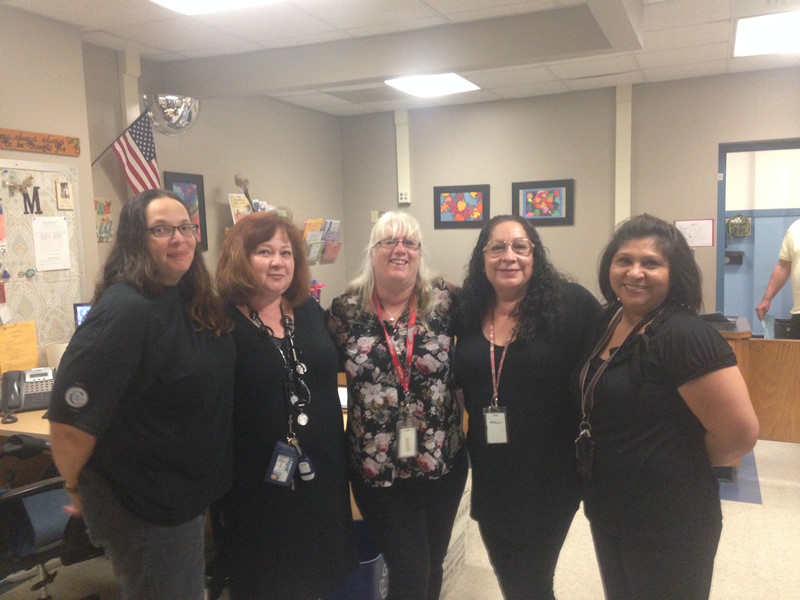 5 women wearing all black clothing